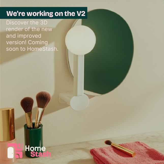 Adjustable vanity light attached to a circular mirror, softly illuminating a makeup area with brushes and a pink towel on a marble countertop.