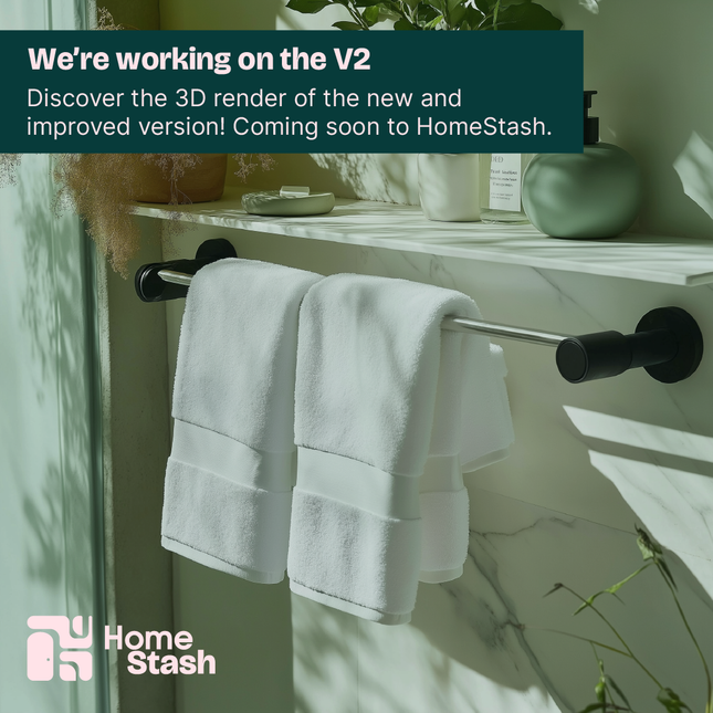 Promotional image of a wall-mounted towel bar in a modern bathroom, announcing the upcoming V2 design for HomeStash. Includes greenery, soft lighting, and minimalist decor.