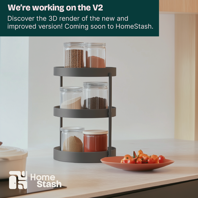 Rotating spice rack with three tiers holding glass jars filled with spices. The rack is placed on a modern kitchen countertop near a plate of fresh tomatoes. Minimalist design with warm natural lighting and clean kitchen decor.