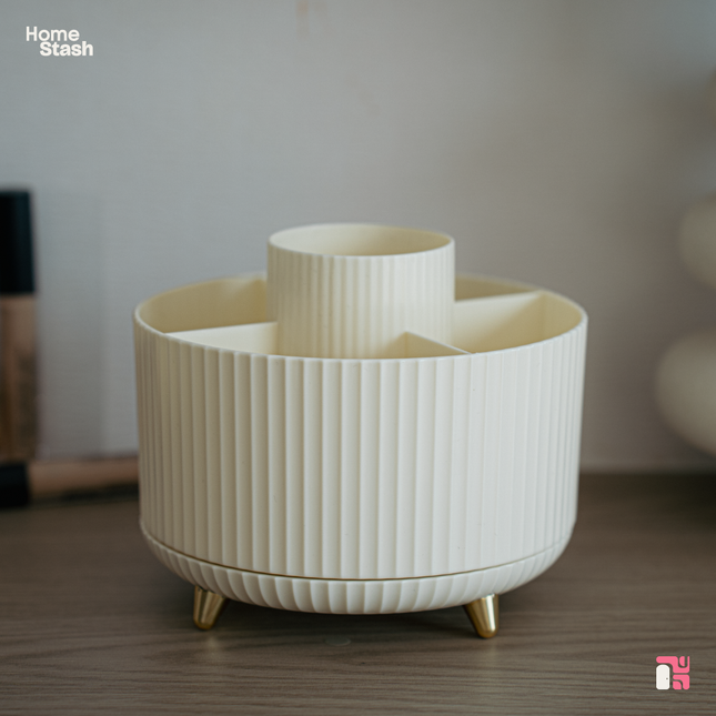 Empty white makeup organizer, rounded shape with golden feet and japandi texture against modern blurry background.